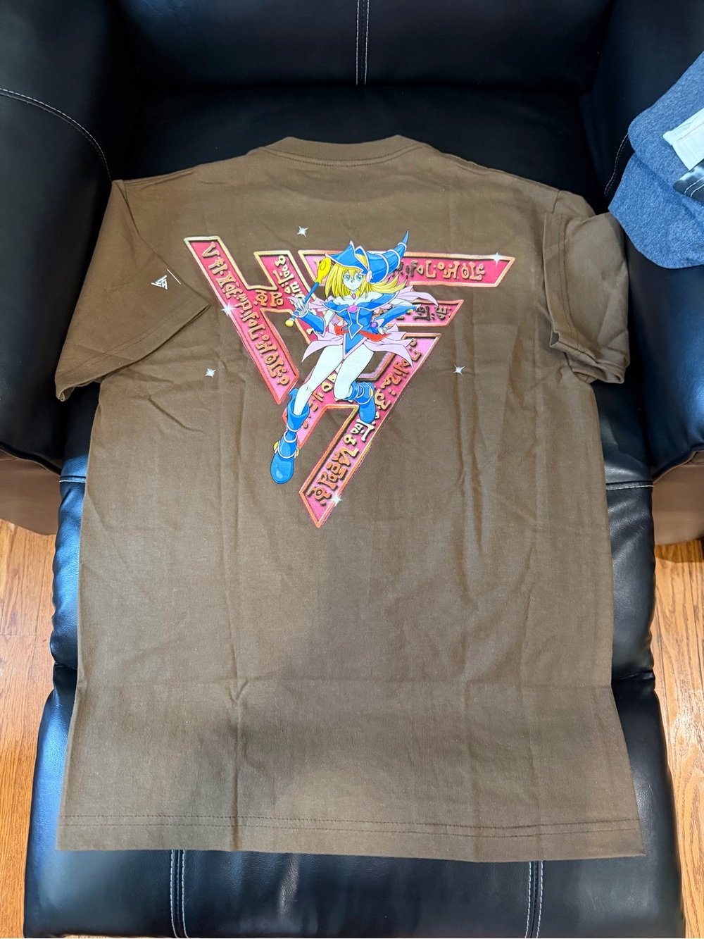Brown Short-Sleeve Graphic Tee with Colorful Anime Illustration